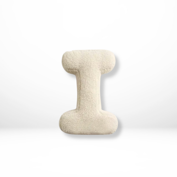 Dekorativ alfabetpude med fløjlsstruktur til boligindretning