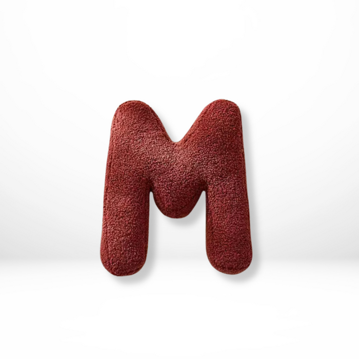 Dekorativ alfabetpude med fløjlsstruktur til boligindretning