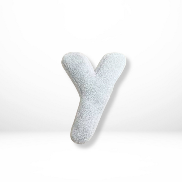 Dekorativ alfabetpude med fløjlsstruktur til boligindretning