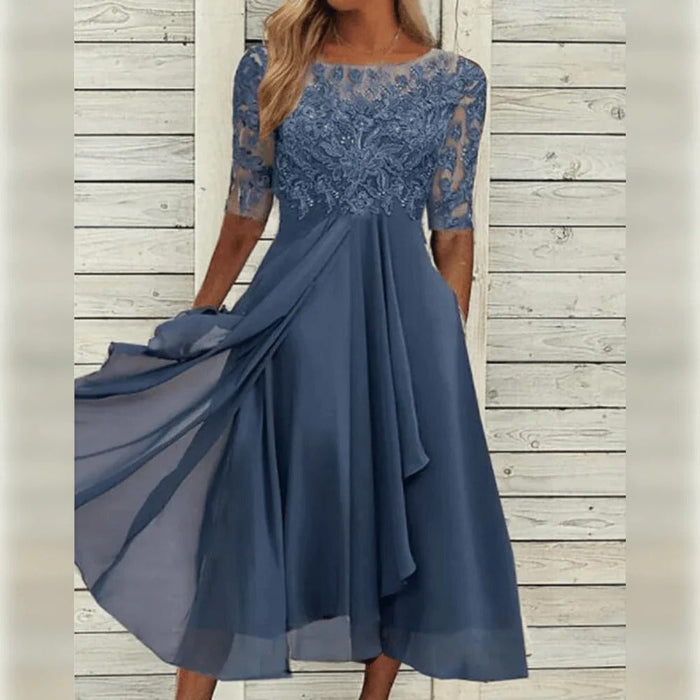 Elegantti midi-mekko pitsiyksityiskohdilla ja laskeutuvalla helmalla juhlahetkiin