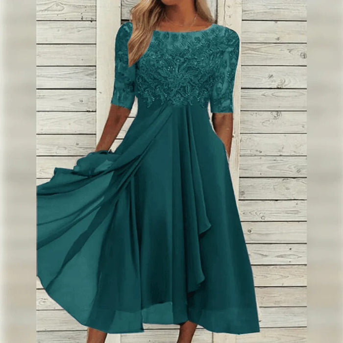 Elegantti midi-mekko pitsiyksityiskohdilla ja laskeutuvalla helmalla juhlahetkiin