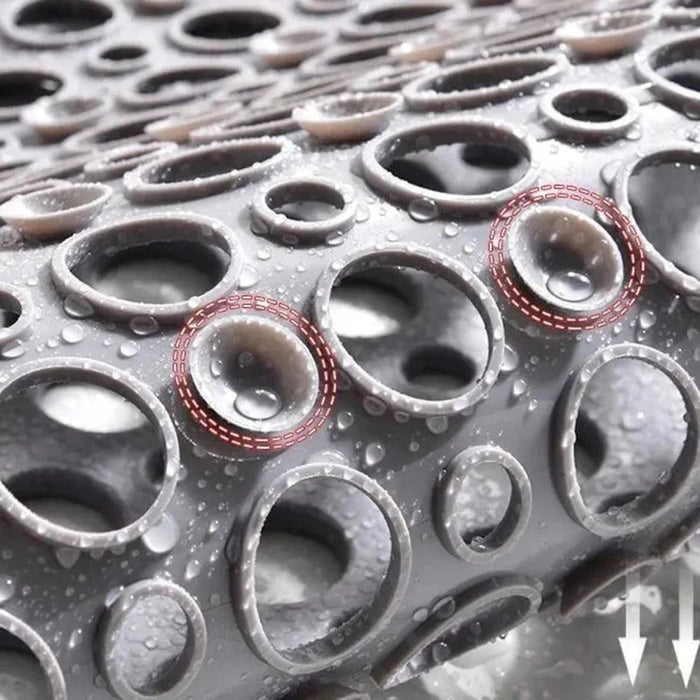 Halkfri duschmatta med sugkoppar och vattenavrinning för säkerhet i badrummet